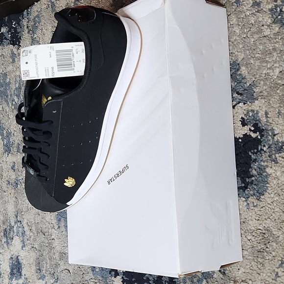 adidas Other - Men's Superstar Pure Black Sneakers Gold Trefoil Logo FZ2145